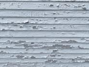 Peeling Paint on exterior of the house. Clapboards will be repaired or replaced, and the exterior primed and painted.