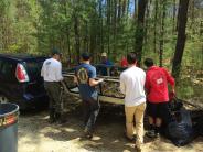 Volunteers load truck cap