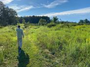 Birder at Oyster River Forest