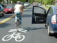 sharrow bicyclist open car door